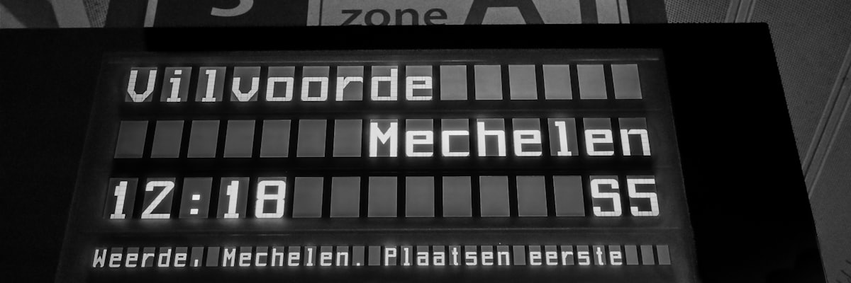 Split-flap departures board showing times and platforms